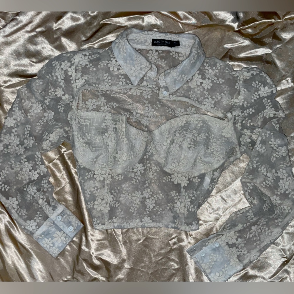 White tool crop top with flower pattern; button collar and open chest